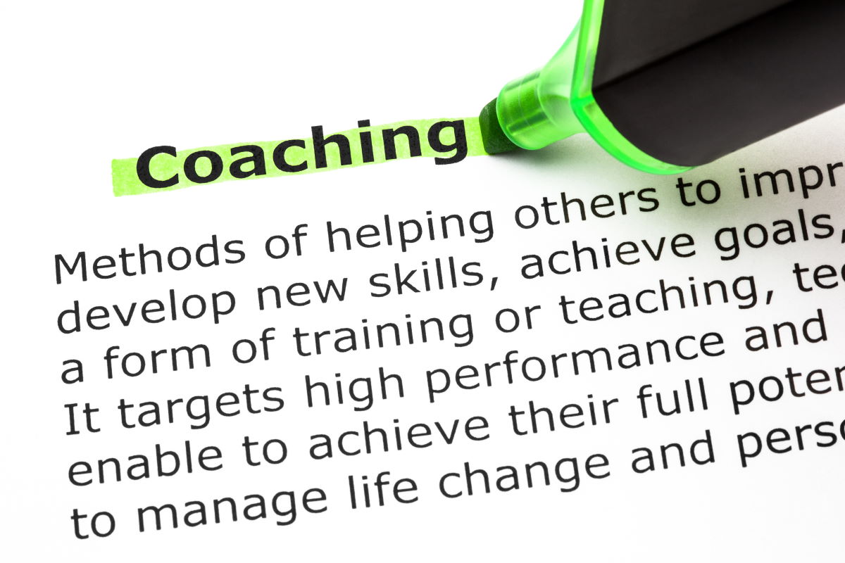 Definition of the word Coaching, highlighted with green text marker.